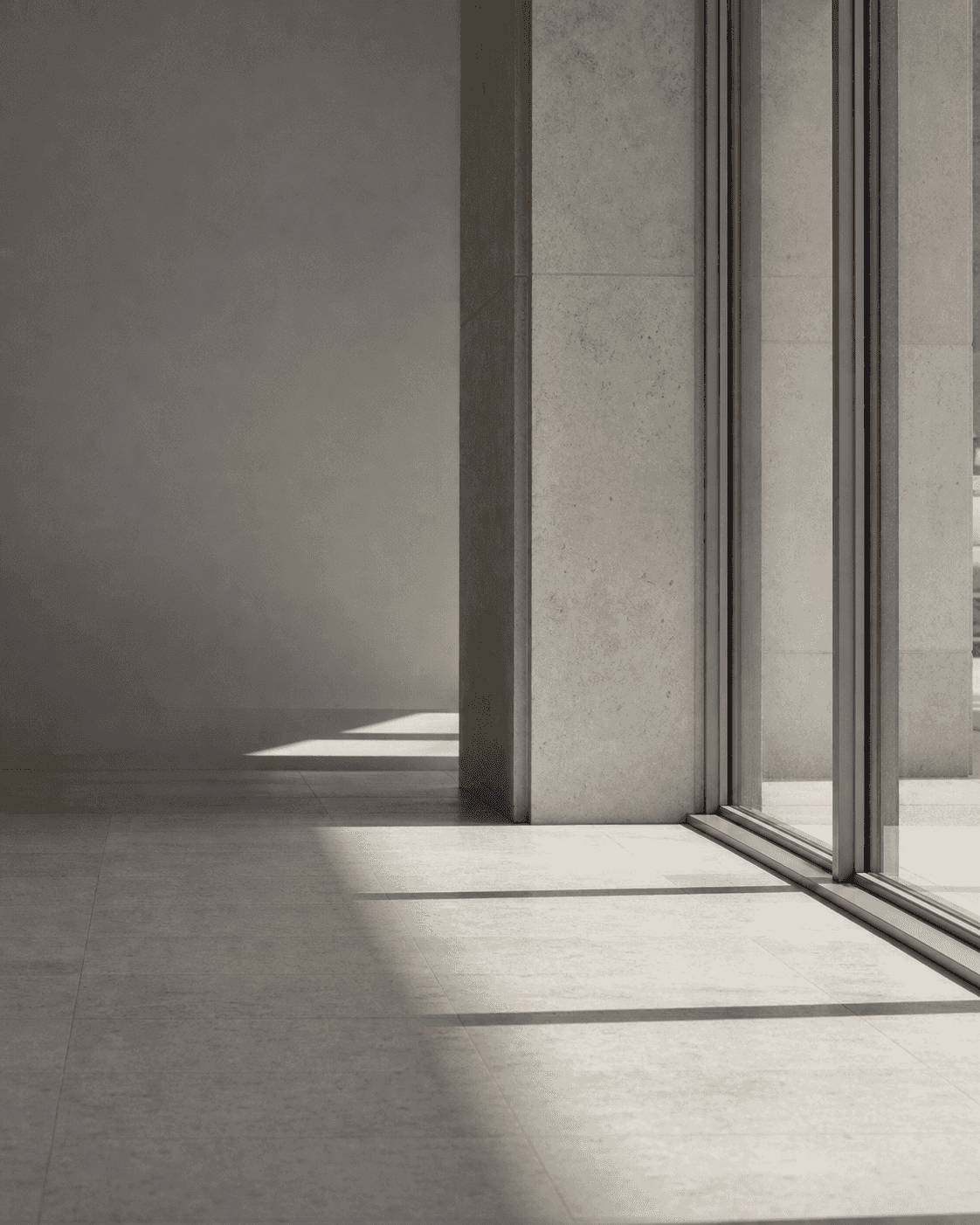 soft morning light through glass onto pale concrete, no people, quiet and architectural